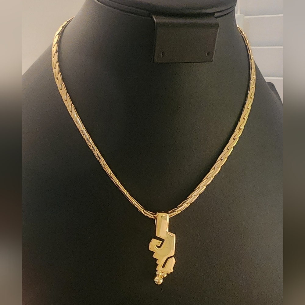 Elegant Gold Tone Necklace with Unique Pendant